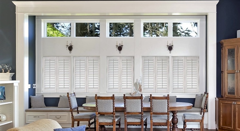 Raleigh dining room with white plantation shutters.